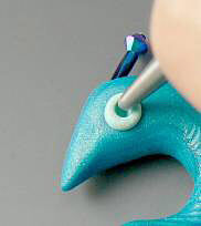Eye of clay peacock being formed